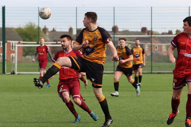 AFC Robin, orange and black kit, look to win the ball at Brid Rovers 1903 in Saturday's showdown. PHOTOS BY TCF PHOTOGRAPHY