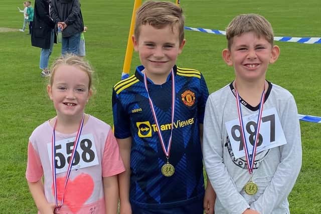 Octoberfest winners show off their medals