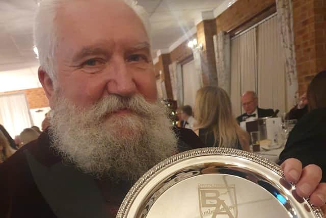 Bob Taylor with the BA ‘Harbour Hero Award’. Photo courtesy of Candy Mitchell
