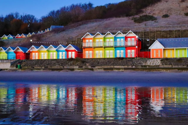 Colourful beach huts, by Jenna Jackson