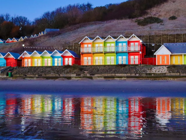 Colourful beach huts, by Jenna Jackson