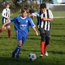 Heslerton Under-15s, blue kit, in action against Dunnington. PHOTO BY CHERIE ALLARDICE