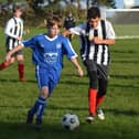 Heslerton Under-15s, blue kit, in action against Dunnington. PHOTO BY CHERIE ALLARDICE