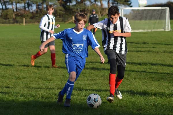 Heslerton Under-15s, blue kit, in action against Dunnington. PHOTO BY CHERIE ALLARDICE