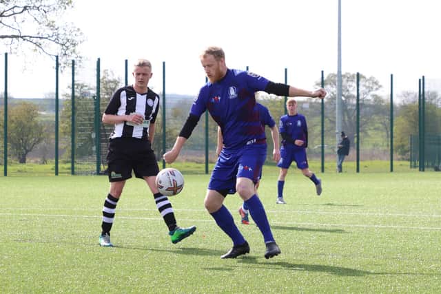 Pandas get the ball under control in the league clash.