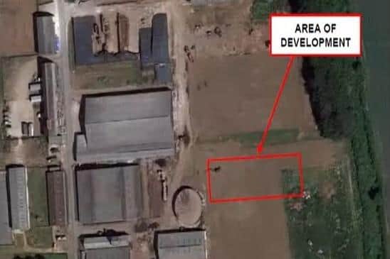 The structure will sit among other agricultural buildings