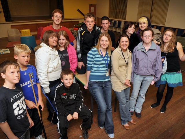 Lindsay Hicklin, centre, chief youth worker, and Lisa Stubbings, youth leader, with youngsters who enjoy going to St Columba's Church Youth Group, which was awarded a £1,000 council grant for new equipment.