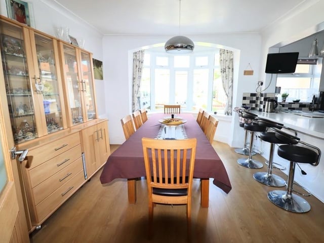 The dining room is open plan to the kitchen.
