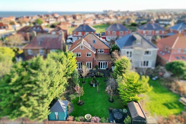An aerial view of the house and garden.
