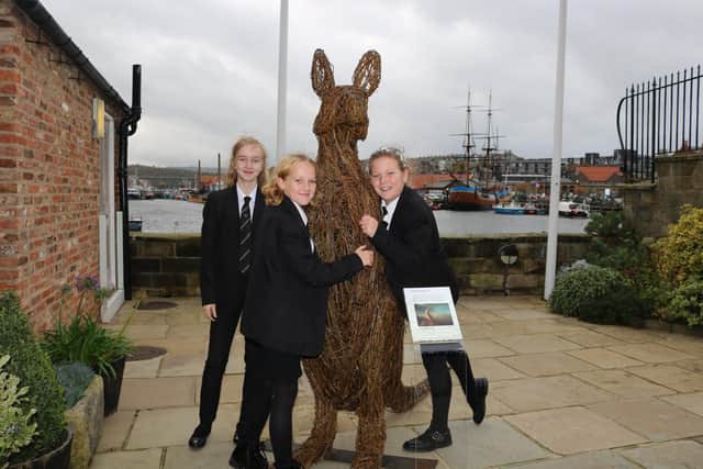 Pupils enjoying the Captain Cook Museum's kangaroo sculpture.