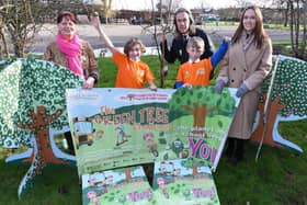 Pupils at St Mary’s C of E Primary School celebrate Green Tree Travel Week with, from left, Wendy Copley, teaching assistant and eco lead, Christian Jordan, assistant road safety officer, and headteacher Laura Wallis.