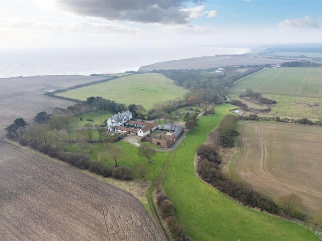 A wider overview of the property showing its proximity to the coast.