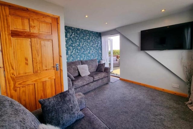 This bedroom with access to the first floor balcony is currently used as a lounge.