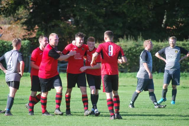 Union Rovers players Zac Holmes, Steve Twamley, Josh Ward, Jamie Allen and Luke Scott celebrate a goal in their 7-2 win at Thornton Dale