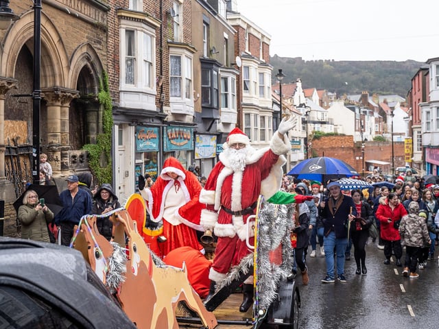 Santa and his elves making their way up Eastborough.