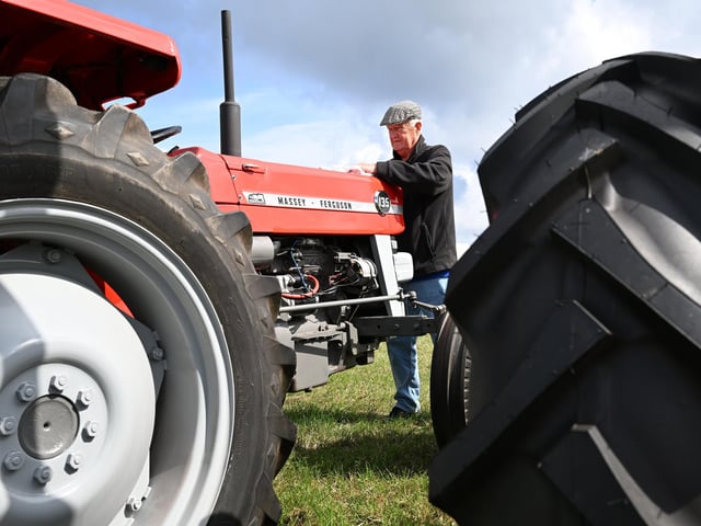 Ray Green polishing his tractor.