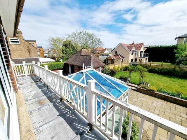 A decorative upper terrace looks out over the garden.