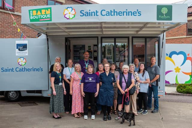 Louise, front centre, celebrates completing an incredible 1,500 miles in support of Saint Catherine’s, surrounded by members of Bridlington Veterans Group and Saint Catherine’s staff.