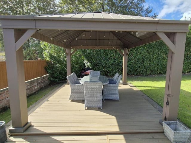 A decked dining area with pagoda.