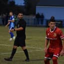 Michael Coulson, red shirt, put Brid Town ahead at Ossett United. Photo by Bailey Beaden