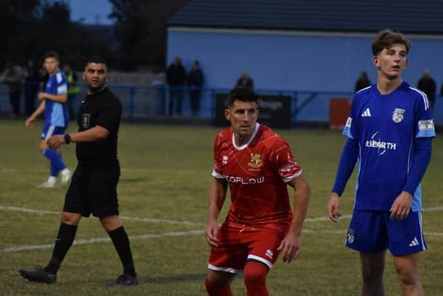 Michael Coulson, red shirt, put Brid Town ahead at Ossett United. Photo by Bailey Beaden