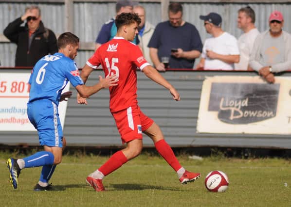 Cam Connelly in action for Brid Town against Dunston in the FA Cup