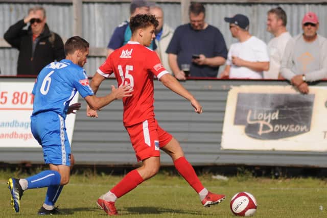Cam Connelly in action for Brid Town against Dunston in the FA Cup