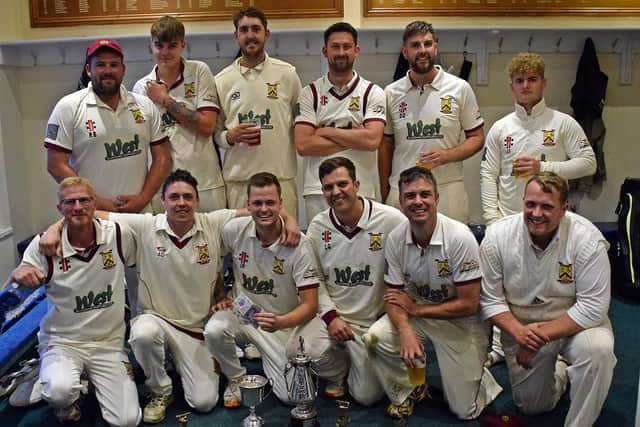 Staxton players celebrate their Hospital Cup final win against Malton & Old Malton.