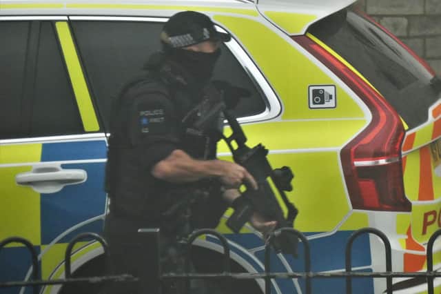 Specialist firearms officers armed with rifles were pictured near the scene of the incident. (Photo: Joseph Young)