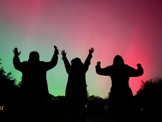 Fabulous silhouette of people having fun looking at the skies in Scarborough.