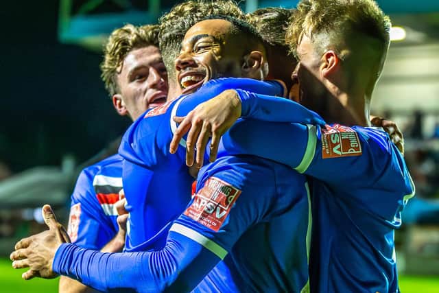 Junior Mondal celebrates putting Town 2-0 ahead against City.