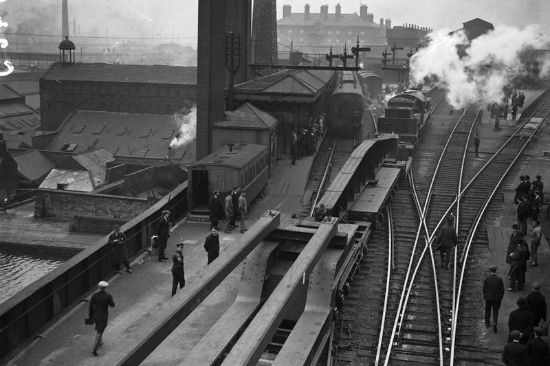 A large goods train of special wagons of the London and North Eastern Railway (LNER) passing through Sheffield Victoria Station in April 1930. The train was intended to showcase the railway's freight-carrying capacity and is being shown to a party of nearly four hundred guests of the Sheffield Rotary Club and the LNER.