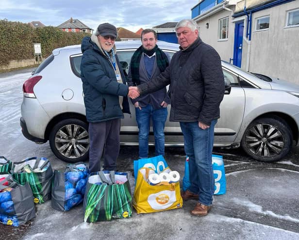 Pictured from left: Chris Taylor from Whitby Foodbank, Whitby Town Commercial Manager, Paul Connolly and Whitby Town Chairman, Ivor Homer.