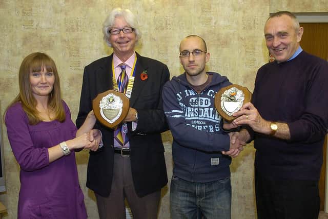 Fun Run and Half Marathon winners pick up their trophies at the Balmoral Hotel in 2007. (PA0745-13b)