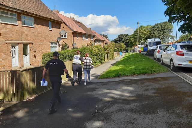 Suspect being led away by police at Barrowcliff. Courtesy Anttoni Numminen