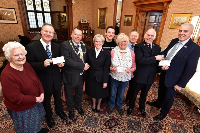 The Festive Spectacular cheque presentation at Scarborough's Town Hall in 2019. Secretary for the Festive spectacular Eileen Cole, Mike Tyas of Westway Open Arms, Mayor Joe Plant, Capt Angela Noble, Police Cadet Mally Leybourn,Trish Kinsella of The Rainbow Centre, Graham Elliot Committee meber of festive group, Major Steve Noble and Organiser Nigel Wood.