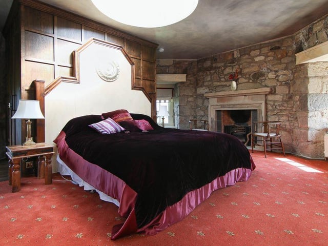 The bedroom is accessed via a spiral stone staircase and is generous in size, with its own en-suite facilities.