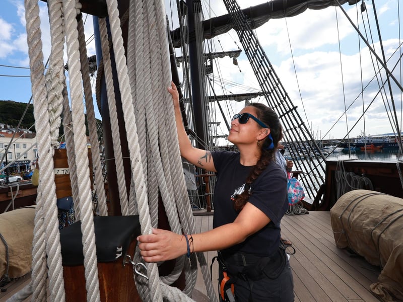 Staff working on board the replica.