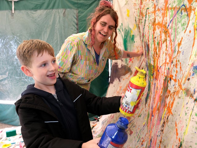 A youngster tries his hand at some artwork.