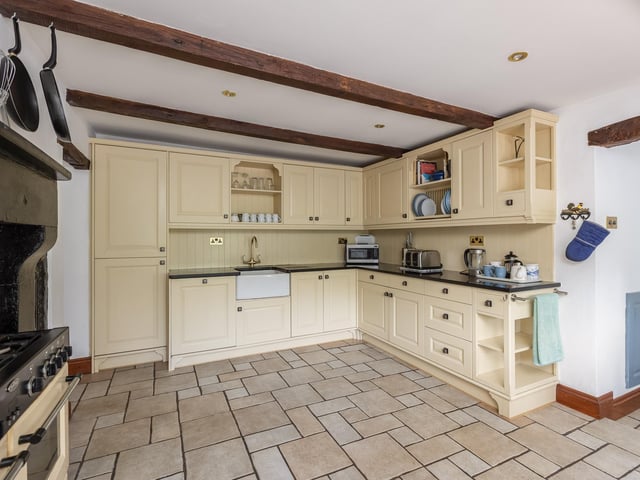 Inside the beamed, farmhouse style kitchen.