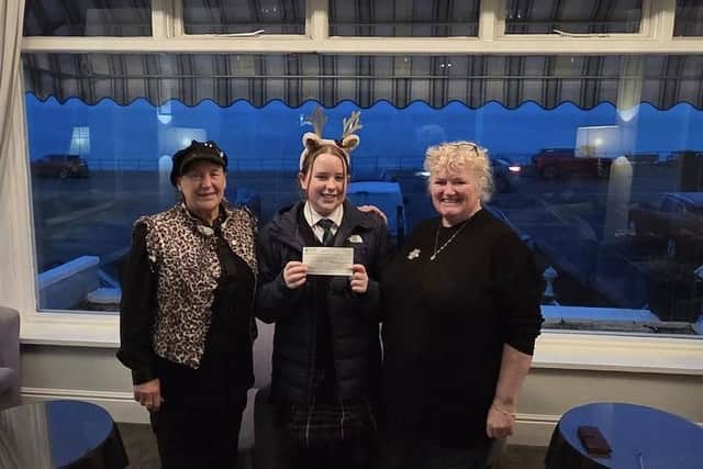 Lily receives a £500 donation from Lynn Parsons and Shirley Smith of Scarborough Hospitality Association