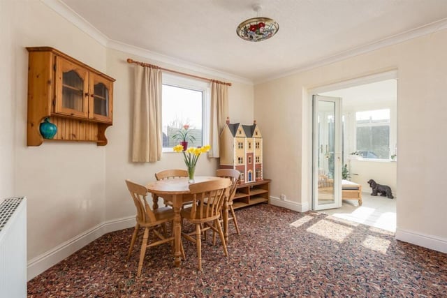 Flexible space currently in use as a dining room.