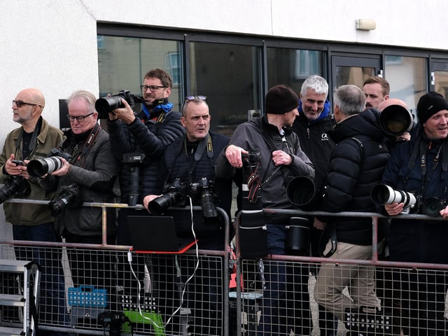 Photographers wait to capture the perfect shot