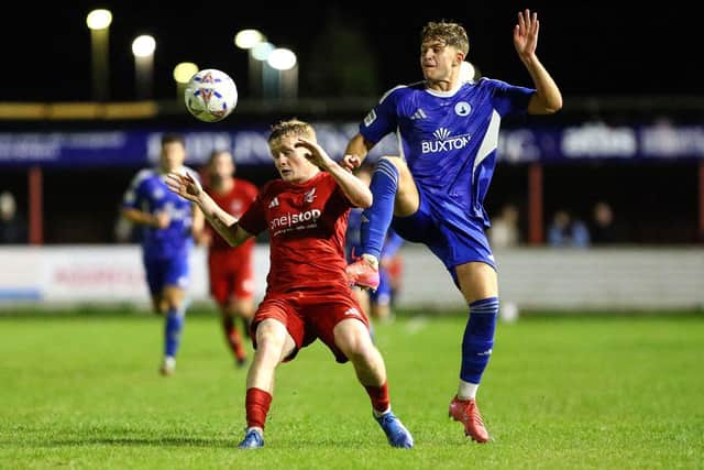 Boro winger Harry Green feels the force of this Buxton challenge. Photo by Zach Forster