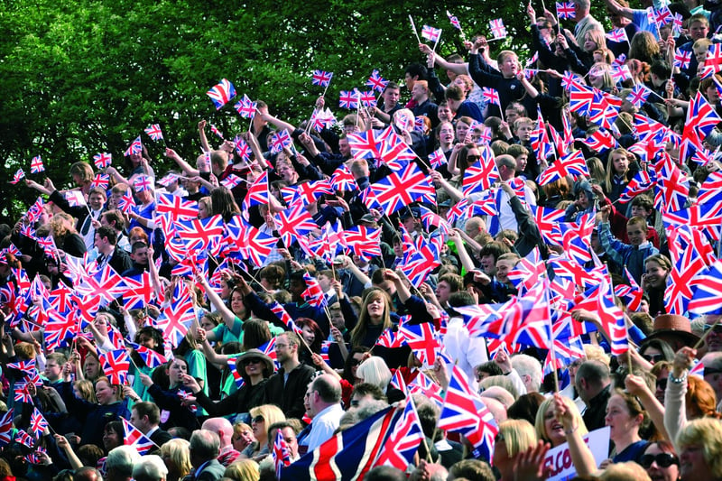 Queen opens the Open Air Theatre - a sea of waved Union Jack flags for the Queen's arrival.
102036n