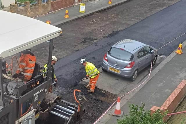 Highway maintenance men decided to tarmac around the silver Vauxhall Corsa hatchback while the rest of the road was resurfaced on Thursday (5/10). Pictures show the 2008 car parked opposite a large yellow sign, which clearly reads: "Surfacing works. No parking between 6pm and 6am."