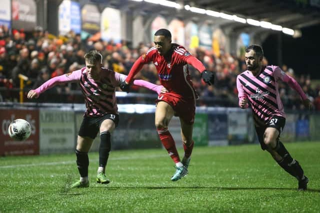 Boro forward Kole Hall gets to grips with Curzon's Will Hayhurst.