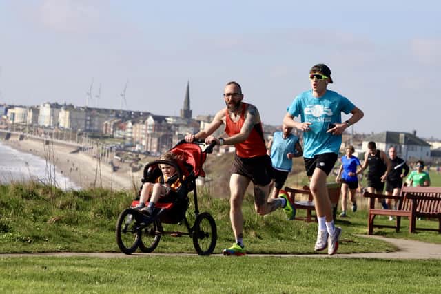 Phill Taylor pushes his buggy around the parkrun.