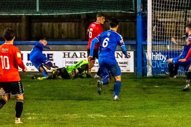 Dan Rowe forces home the leveller for Whitby Town