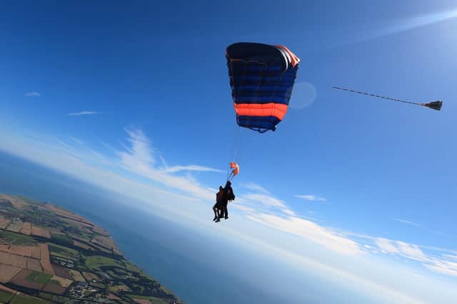 Mr Mattinson with instructor Alec Flint flying high above the coastline. Photo: Vance Allen